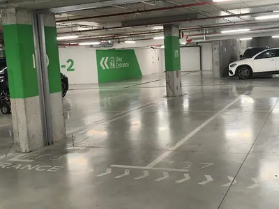 a parking garage with a car parked in it at Gallery Mall View-studio in Belgrade
