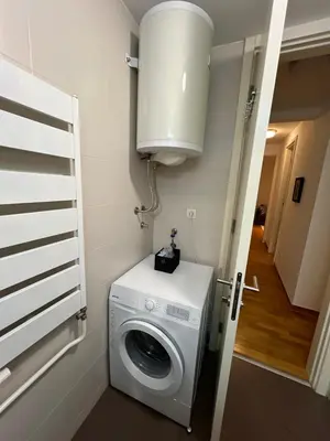 a washer and dryer in a small room at Belville city view in Belgrade
