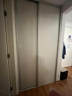 a pair of sliding doors in a room at Belville city view in Belgrade