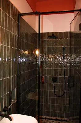 a bathroom with a shower with a glass door at Belgrade 1920 in Belgrade