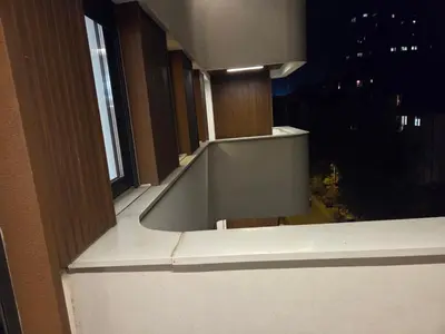 a window with a view of a city at night at Apartman-Stan in Belgrade