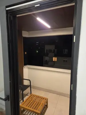 a view of a room with a window and a bench at Apartman-Stan in Belgrade