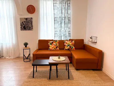 a living room with a couch and a table at Lukerly 2 in Belgrade