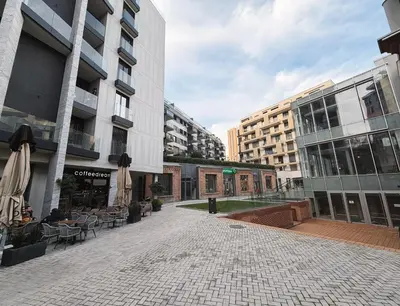 an empty street in a city with tall buildings at SARA Lux Novi Dorcol in Belgrade