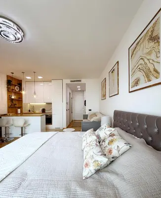 a bedroom with a large bed with two pillows on it at SARA Lux Novi Dorcol in Belgrade