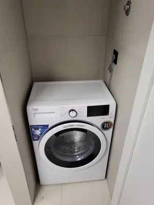 a washing machine in a corner of a room at SARA Lux Novi Dorcol in Belgrade