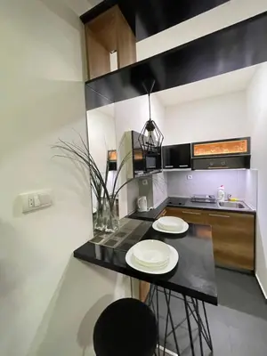 a kitchen with two white plates on a black counter at Skadarlija Nest in Belgrade