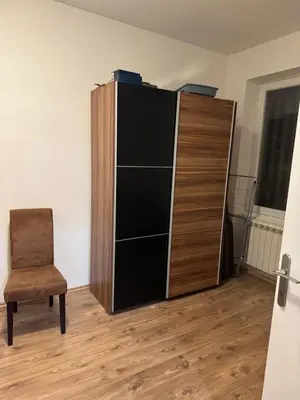 a cabinet and a chair in a room at Center Belgrade in Belgrade