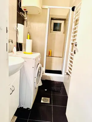 a small bathroom with a toilet and a sink at Center Belgrade in Belgrade