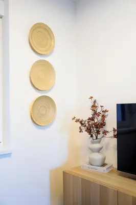 a room with a vase and plates on a wall at Villa Vista Slankamen in Stari Slankamen