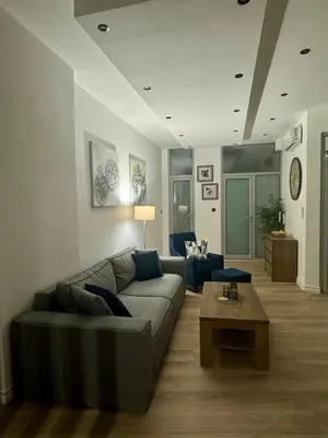 a living room with a couch and a coffee table at WhiteCity Suite in Belgrade