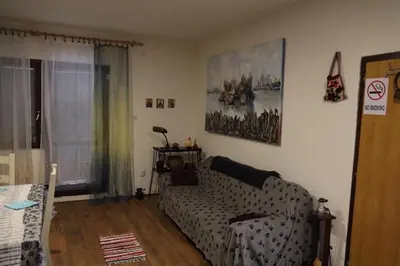 a living room with a couch and a window at Vila Dinara in Krčedin
