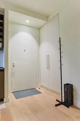 a room with a large white closet with a mirror at The Sensation Belgrade Waterfront in Belgrade