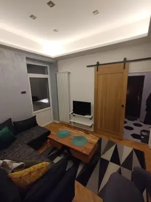 a living room with a couch and a coffee table at Vuk i Vojvoda in Belgrade