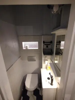 a small bathroom with a toilet and a sink at Vuk i Vojvoda in Belgrade