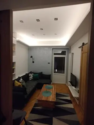 a living room with a couch and a table at Vuk i Vojvoda in Belgrade