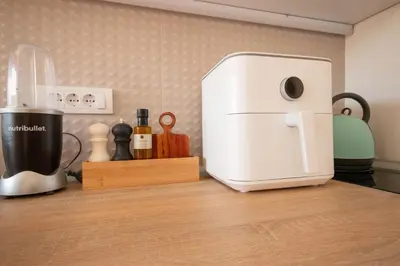 a kitchen counter with a coffee maker and a toaster at NookLite Studio near Belgrade Arena in Belgrade