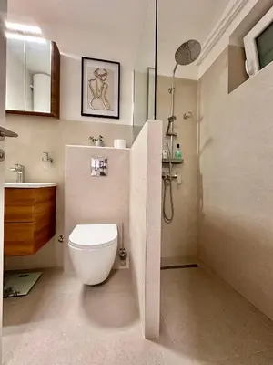 a bathroom with a toilet and a shower at NookLite Studio near Belgrade Arena in Belgrade