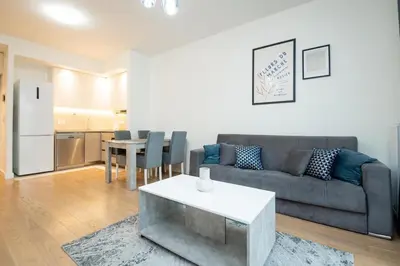 a living room with a couch and a table at BW Terra Lux in Belgrade
