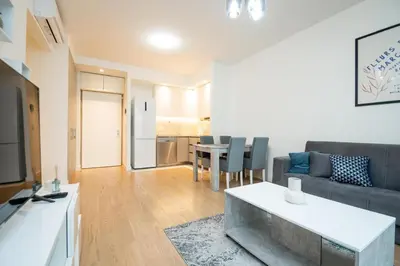 a living room with a couch and a table at BW Terra Lux in Belgrade