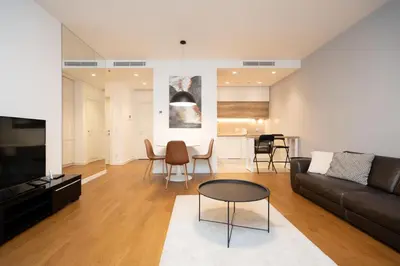 a living room with a couch and a table at West Kula 17 in Belgrade