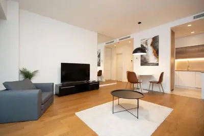 a living room with a couch and a table at West Kula 17 in Belgrade