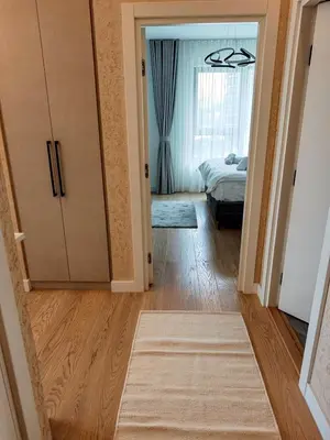 a bedroom with a door leading to a bed at Belgrade Waterfront Primestay in Belgrade