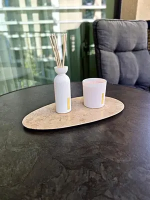 a table with two white vases and a cup on it at Belgrade Waterfront Primestay in Belgrade