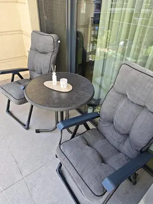 two chairs and a table and a table and chairs at Belgrade Waterfront Primestay in Belgrade