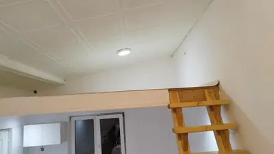 a room with a ladder and a ceiling at Small Apartment private bathroom ,strong internet in Belgrade