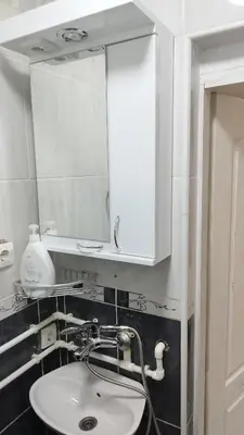 a bathroom with a sink and a mirror at Small Apartment private bathroom ,strong internet in Belgrade