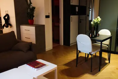 a living room with a couch and a table at Center Luxury Studio Knez Mihailova & Kalemegdan in Belgrade