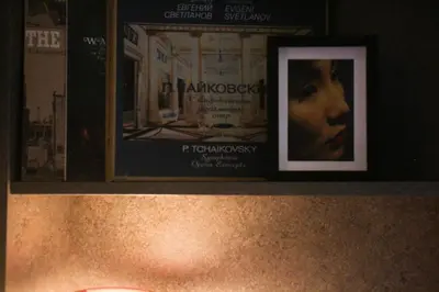 a shelf with a picture of a woman on it at Center Luxury Studio Knez Mihailova & Kalemegdan in Belgrade