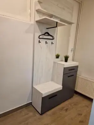 a bathroom with a sink and a mirror at Belgrade Dawn Apartment in Belgrade