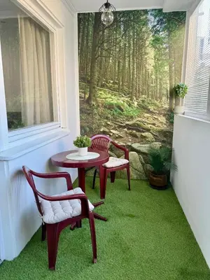 a room with a table and chairs and a window at Bright Elegant Cozy Apartment - New Belgrade in Beograd