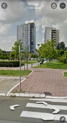 a street with an arrows sign in a city at Bright Elegant Cozy Apartment - New Belgrade in Beograd