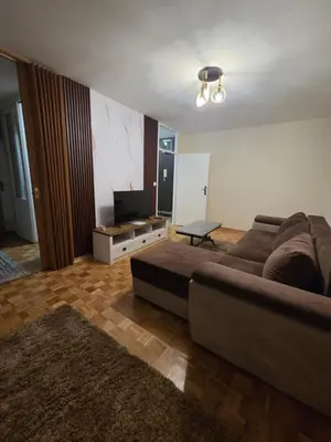 a living room with a couch and a flat screen tv at Viktor in Belgrade