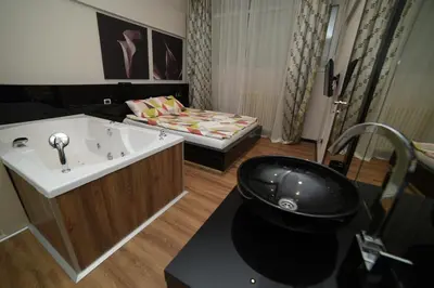 a bathroom with a sink and a bath tub at City Place Apartments in Belgrade