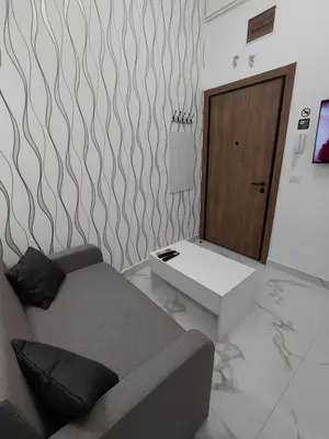 a living room with a couch and a table at Angel Suites in Belgrade