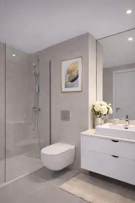 a bathroom with a shower and a toilet and a sink at Aria BW Lux Apartment in Belgrade