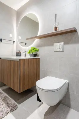 a bathroom with a toilet and a sink and a mirror at Belgrade Waterfront - Beograd na vodi in Belgrade