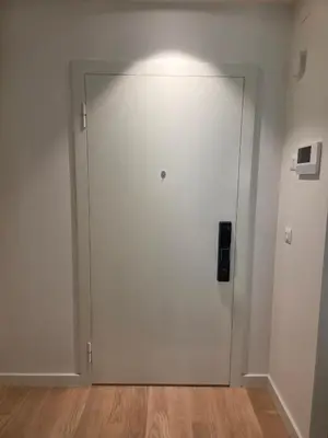 a white door in a room with a wooden floor at Belgrade Waterfront - Beograd na vodi in Belgrade