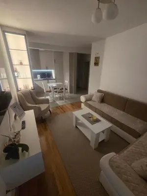 a living room with a couch and a table at Wolf's Wonder in Obrenovac
