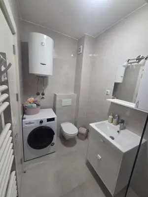 a small bathroom with a toilet and a sink at Wolf's Wonder in Obrenovac