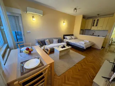 a living room with a couch and a table at Apartment 63 in Belgrade