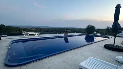 a swimming pool on the roof of a house at Kosmaj-Suncani Breg