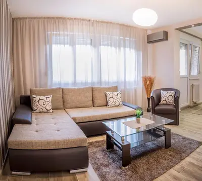 a living room with a couch and a table at Apartment Dositejeva 13 in Belgrade