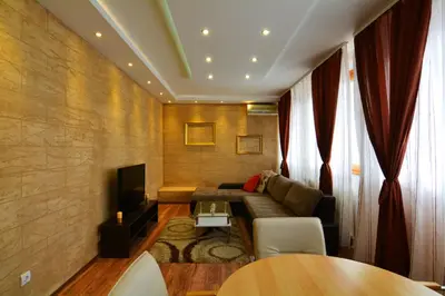 a living room with a couch and a tv at Apartment Dositejeva 13 in Belgrade