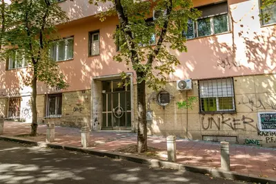 a building with graffiti on the side of it at Apartment Dositejeva 13 in Belgrade