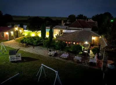 an aerial view of a house with a yard at night at Etno kompleks Deliblatska Čarda in Deliblato